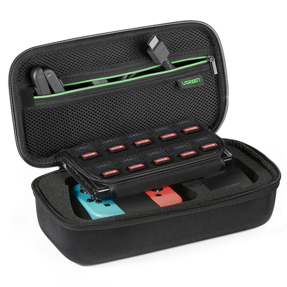 UGREEN black hard-shell Switch case open, holding a Nintendo Switch, Joy-Cons, cables and a row of game cards