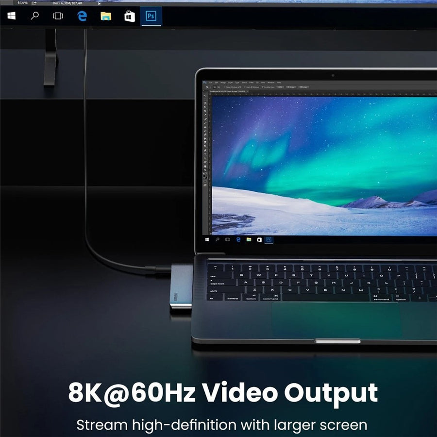 A laptop connected through the hub to a larger display, captioned 8K 60Hz video output
