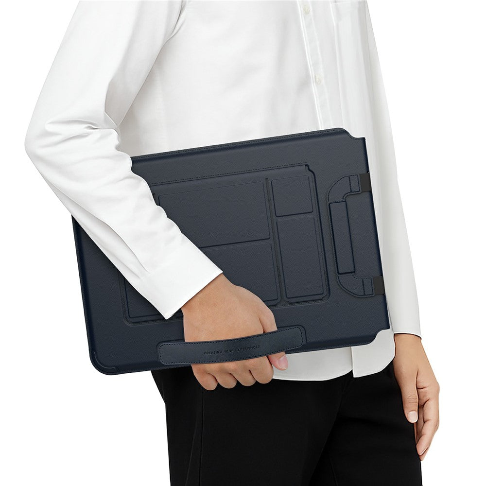 Person in a white shirt carrying the closed Dark Blue Versatile Pro sleeve by its magnetic handle