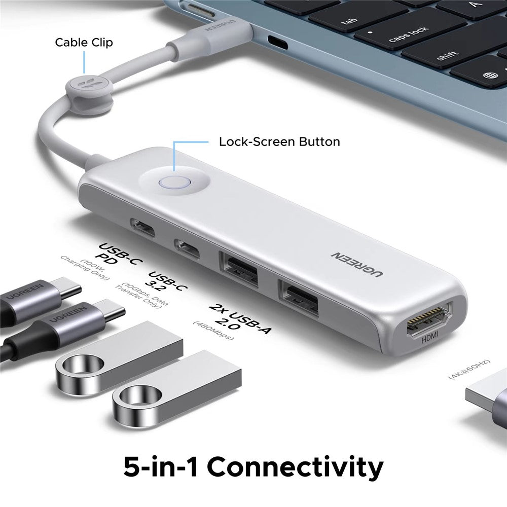 The hub beside a laptop with USB drives and cables, captioned 5-in-1 connectivity, showing its cable clip and lock-screen button