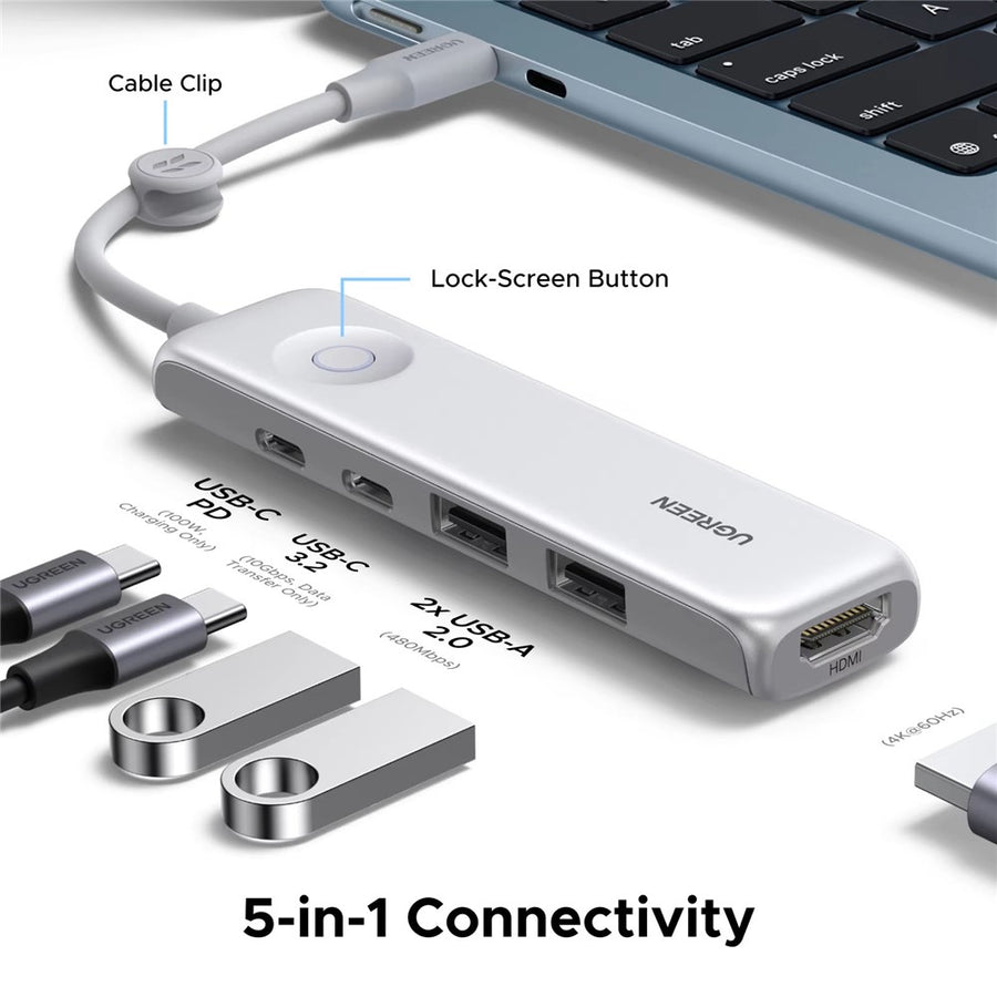 The hub beside a laptop with USB drives and cables, captioned 5-in-1 connectivity, showing its cable clip and lock-screen button