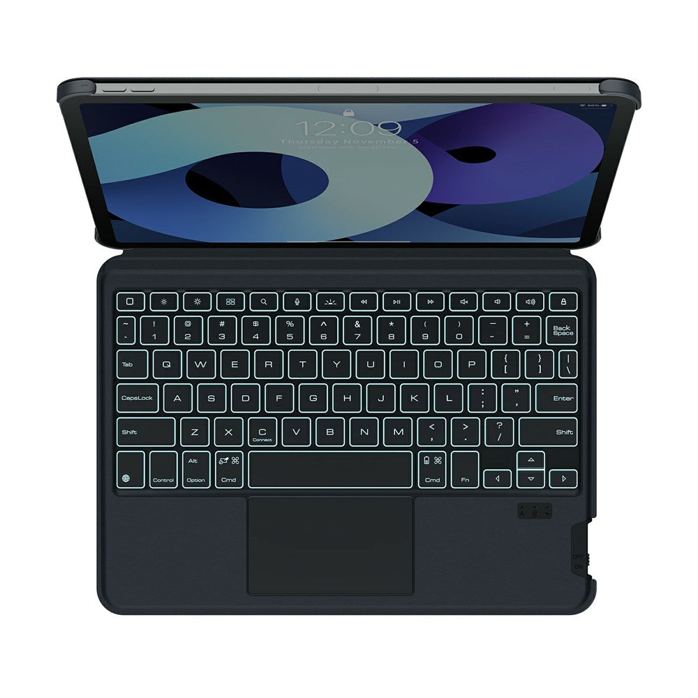 Top-down view of the black MagicEase keyboard with backlighting on, showing the full-size key layout and multi-touch trackpad