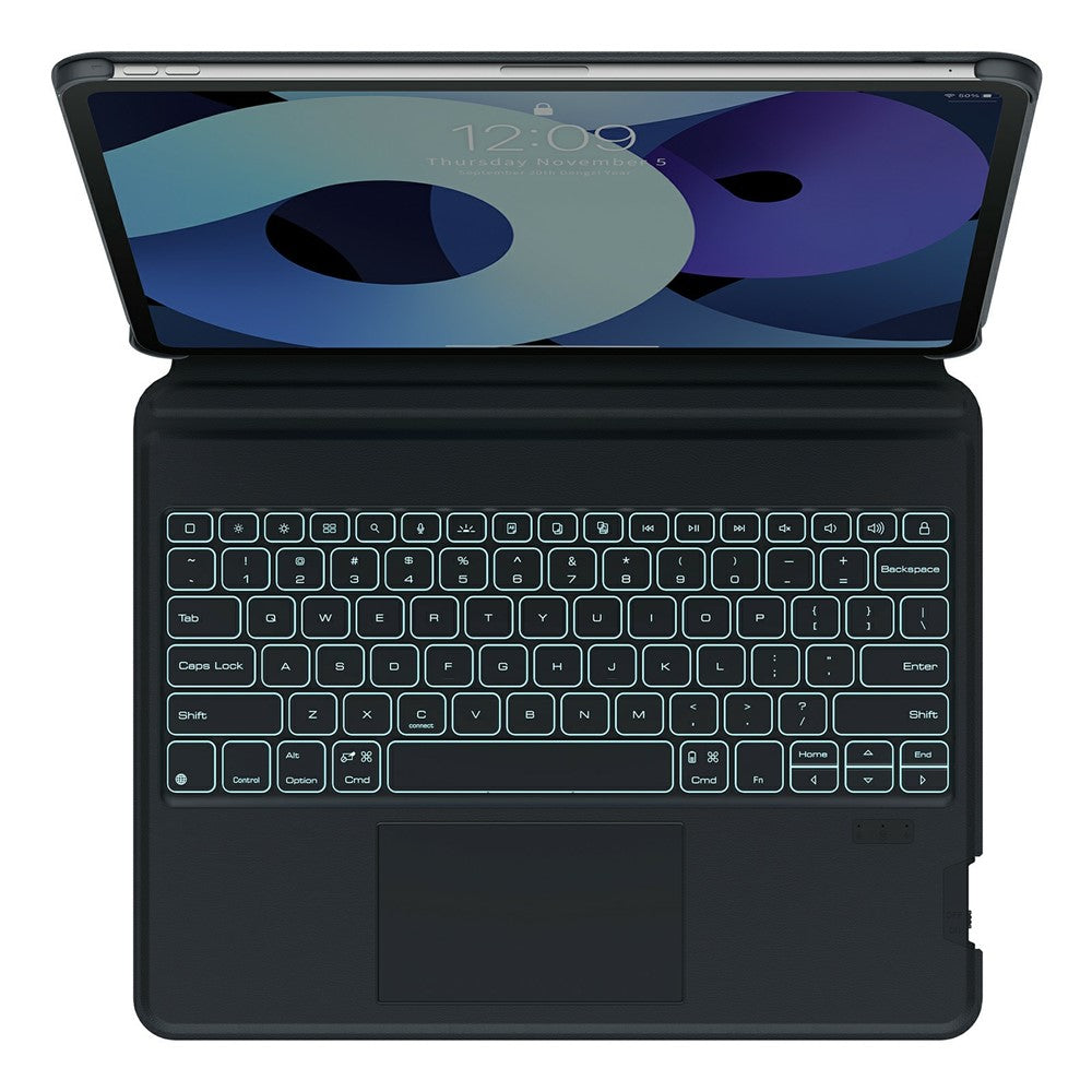 Top-down view of the black MagicEase keyboard with backlighting on, showing the full-size key layout and multi-touch trackpad