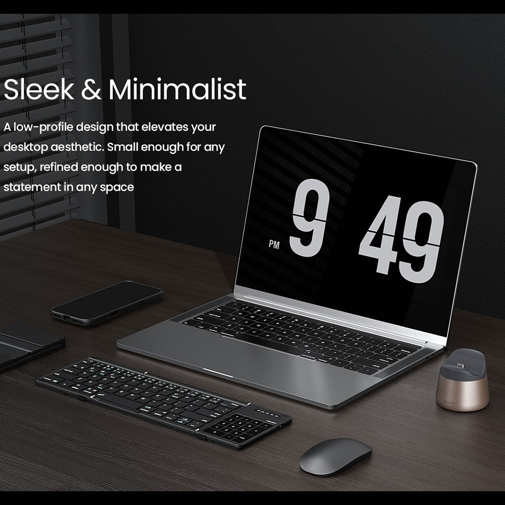 Nillkin slide headed Sleek and Minimalist, showing the RayDock on a dark desk beside a laptop, keyboard and mouse