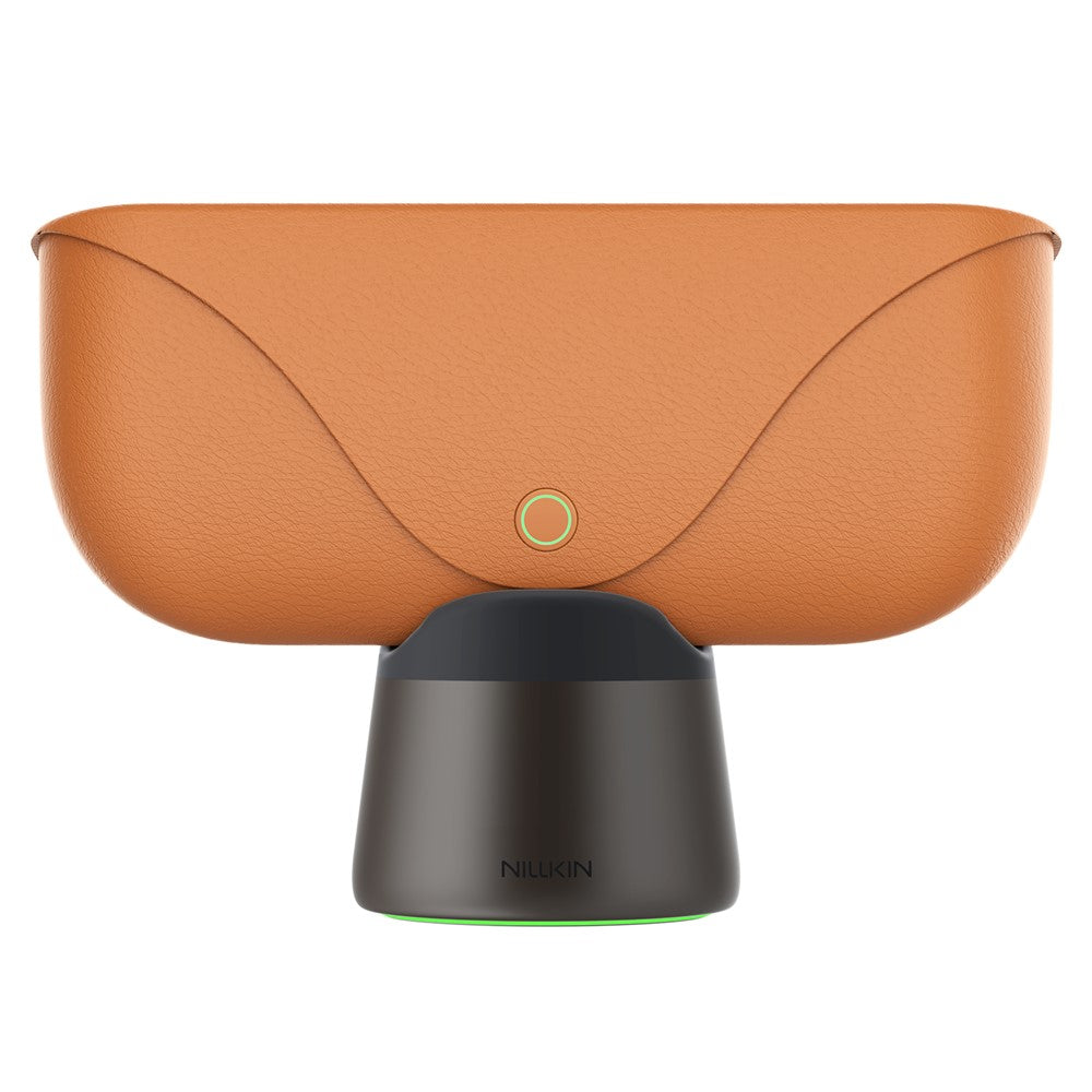 Tan Ray-Ban Meta charging case seated in the Brown RayDock with the ambient light ring at the base glowing green
