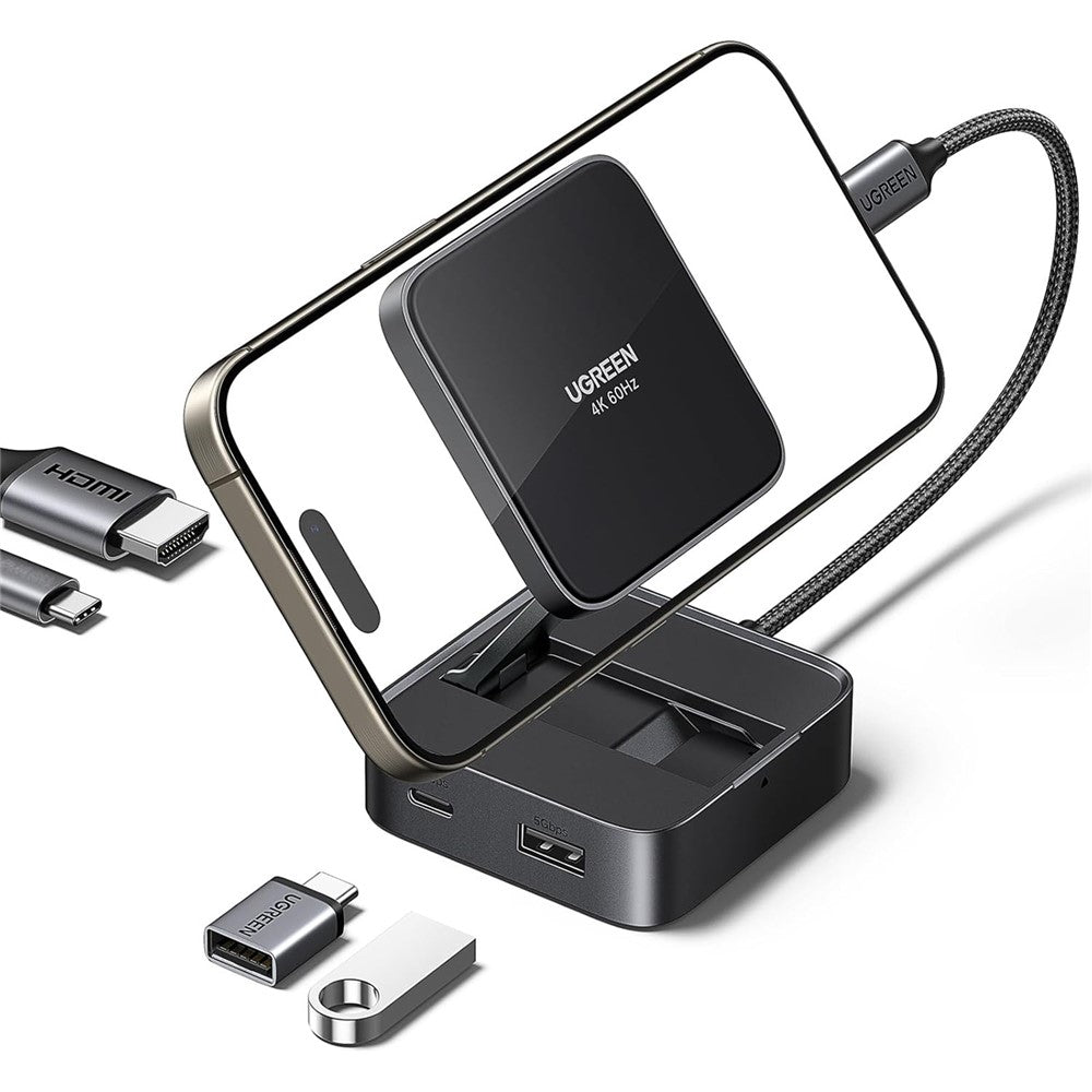 UGREEN 4-in-1 magnetic folding hub holding a phone upright, shown with USB-C and USB-A adapters beside it