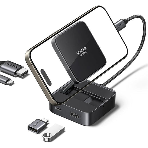 UGREEN 4-in-1 magnetic folding hub holding a phone upright, shown with USB-C and USB-A adapters beside it