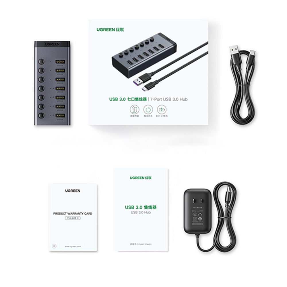 Everything in the box: the hub, its retail box, a data cable, a warranty card, a manual and a power adapter